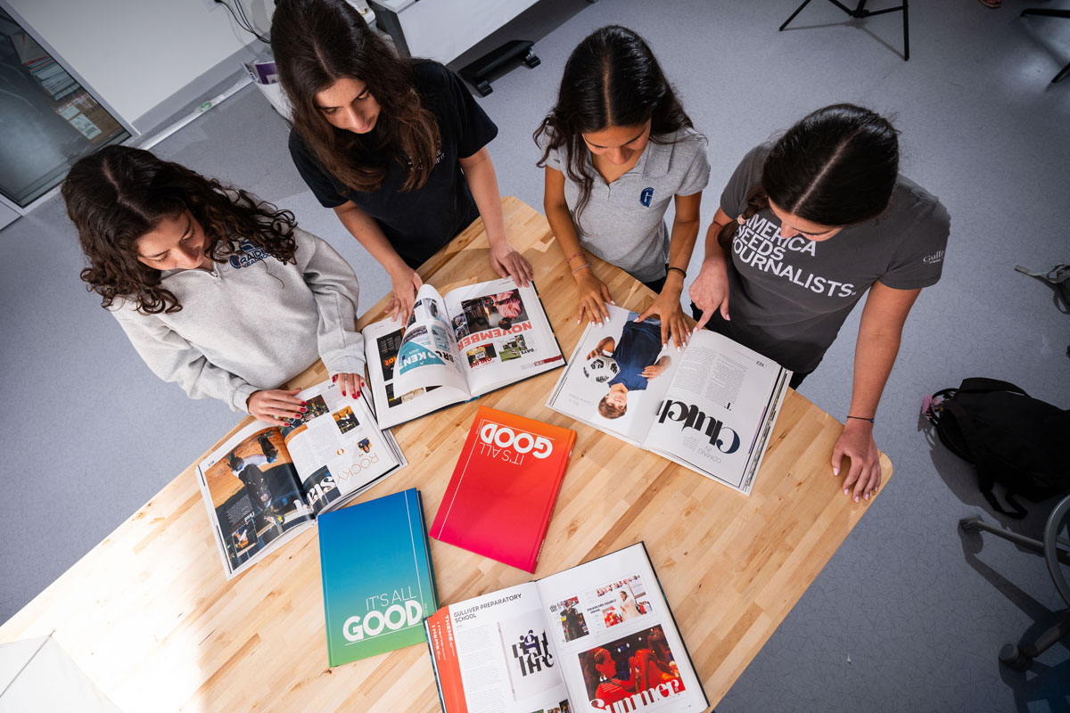 Students looking at yearbooks